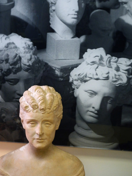 sculpted bust with photo of busts