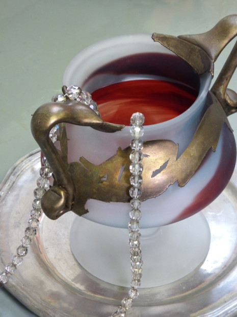 white frosted glass cup with red and gold accents and crystal beads